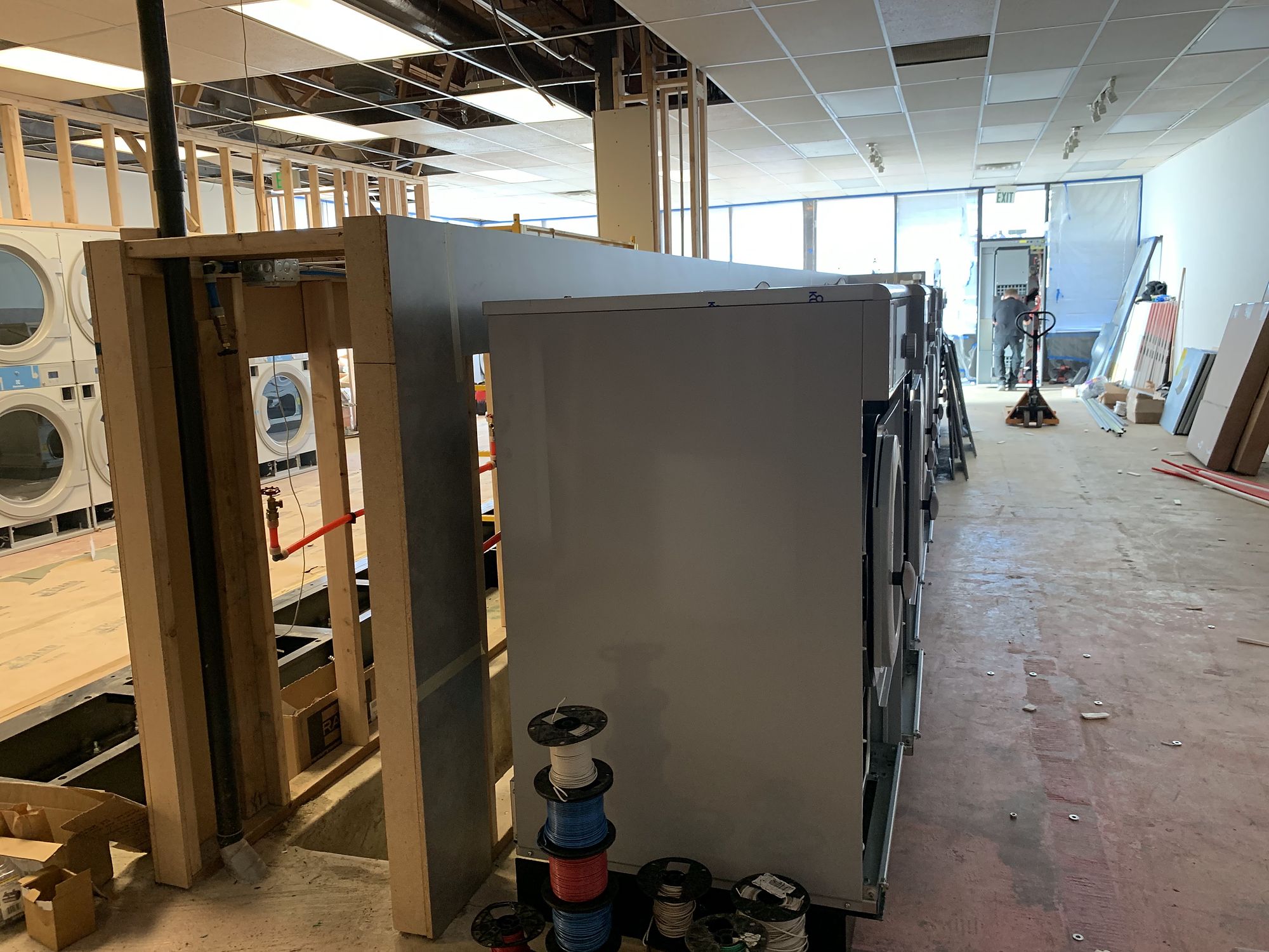 Laundromat build-out — Empty shells turned into working businesses.